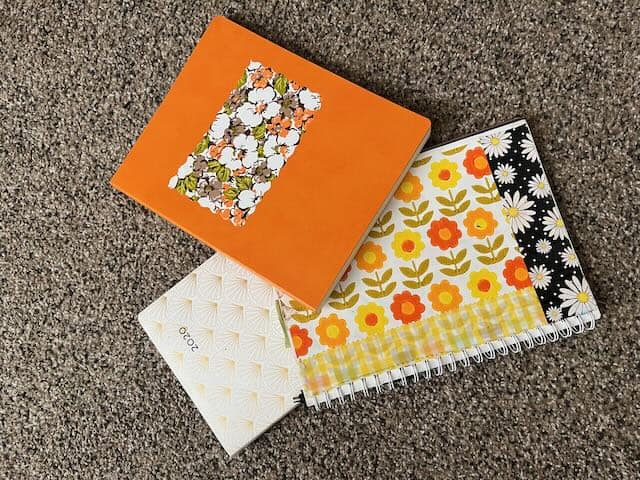 Plain notebooks/journals customized with retro floral MacTac and wallpaper, used to help find your personal style.